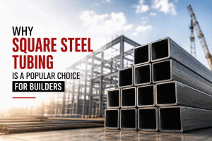 Square steel tubing stacked at a modern construction site